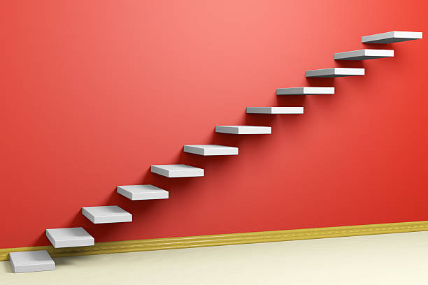 istock Ascending stairs of rising staircase in empty red room 491348006