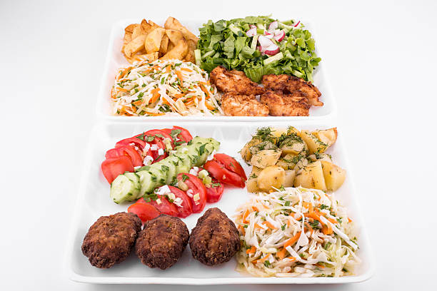 istock fried meatballs and chicken with salad and potatoes 491349368