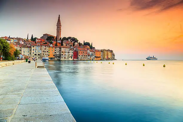 Famous romantic promenade with beautiful old town of Rovinj and magical sunset,Istrian Peninsula,Croatia,Europe
