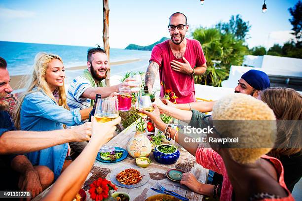 Beach Cheers Celebration Friendship Summer Fun Dinner Concept Stock Photo - Download Image Now
