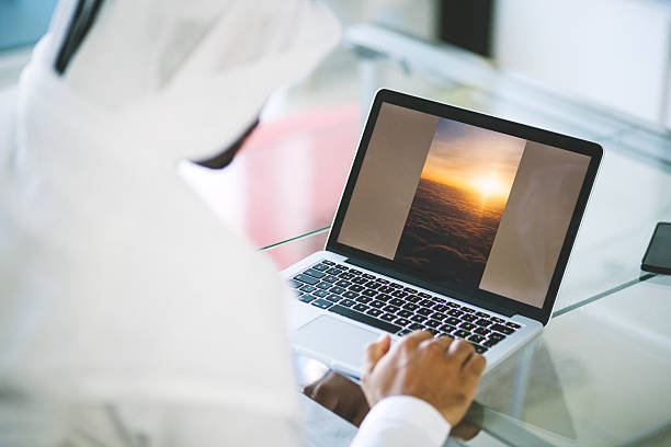 Emirati Man Using Laptop at Home
