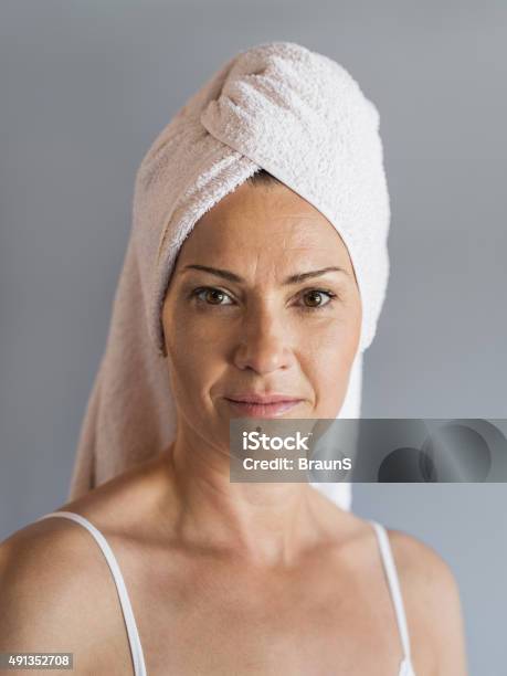 Mature Woman With Towel Wrapped Around Her Head Stock Photo - Download Image Now - 2015, 35-39 Years, Adult