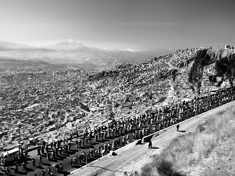 Protest walkout in scenery of La Paz, Bolivia. Black and white image