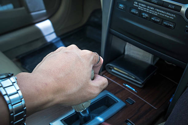 istock Hand of driver shifting gear of automatic car 491360340