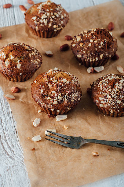 istock Homemade banana peanut muffins on baking paper 491362478