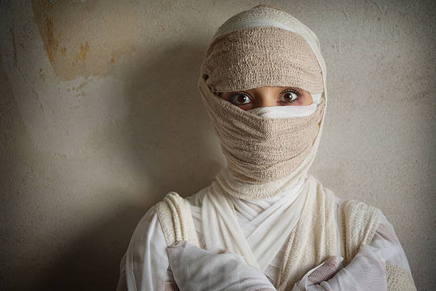 istock woman wrapped in bandages 491365736