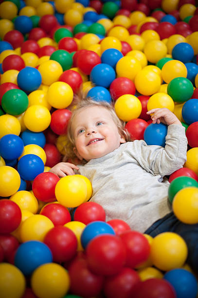 istock Young girl playing in a ball pool 491374633