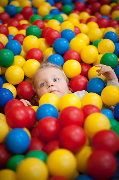 istock Young girl playing in a ball pool 491374661
