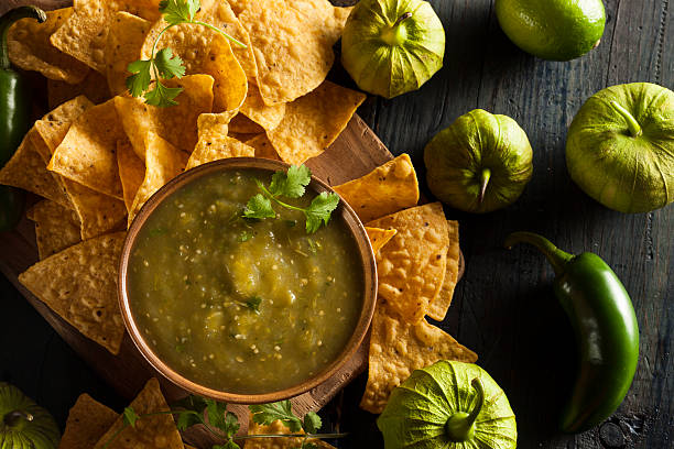 Homemade Salsa Verde with Cilantro Homemade Salsa Verde with Cilantro and Tortilla Chips tomatillo photos stock pictures, royalty-free photos & images