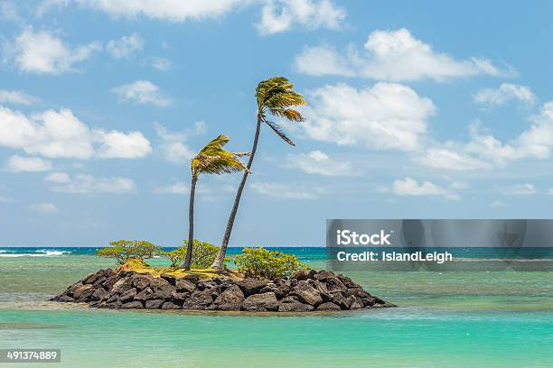 Tiny Rock Island Stock Photo - Download Image Now - Blue, Brown, Cloud - Sky