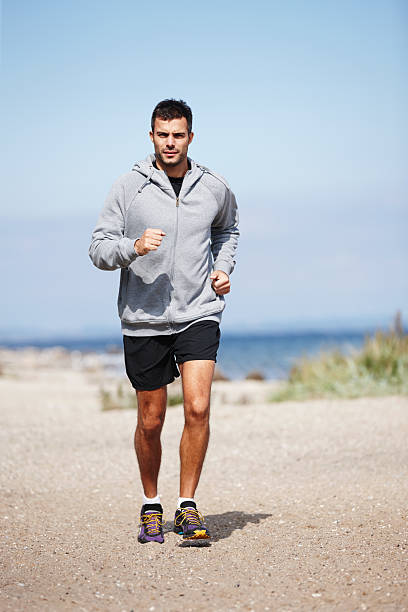 istock Taking a morning run on the beach 491376569