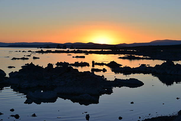 Mono lake at sunrise, the beauty of the sun showing the outline of the Jagged rocks on this volcanic landscape
