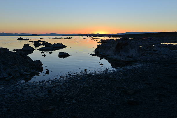 Mono lake at sunrise, the beauty of the sun showing the outline of the Jagged rocks on this volcanic landscape