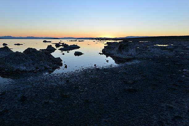 Mono lake at sunrise, the beauty of the sun showing the outline of the Jagged rocks on this volcanic landscape