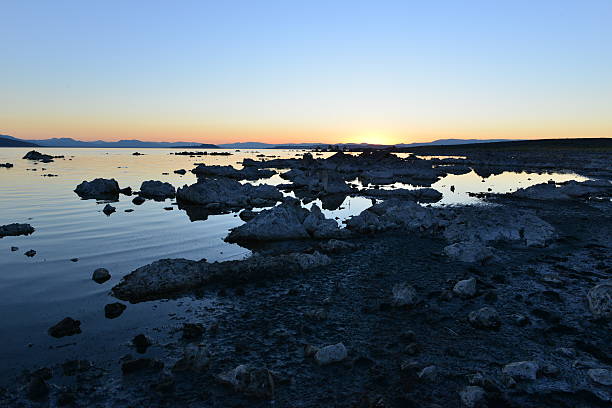 Mono lake at sunrise, the beauty of the sun showing the outline of the Jagged rocks on this volcanic landscape