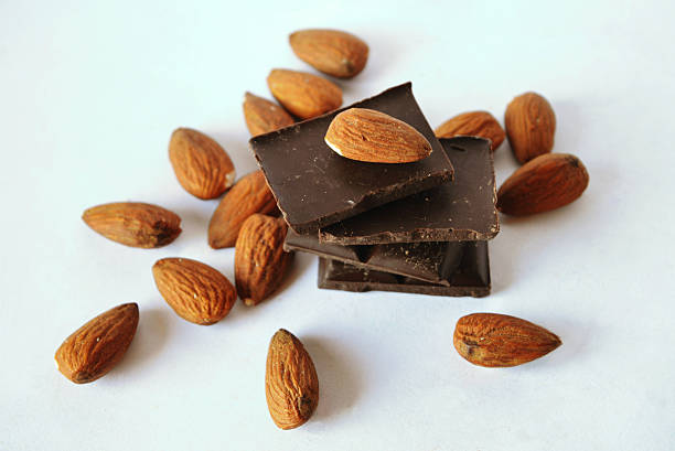 istock Dark chocolate and almonds in vintage colors 491377810