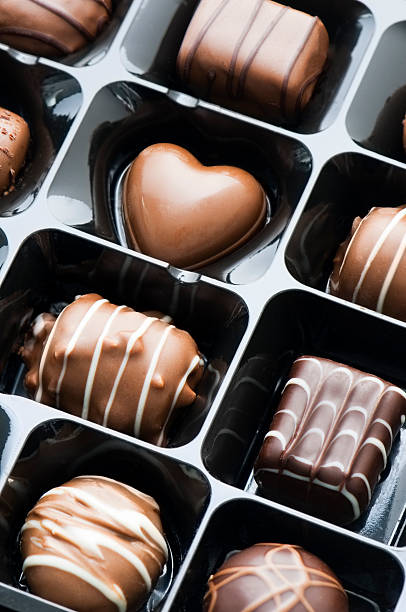 istock Gift box of white dark and milk chocolate candy 491378075