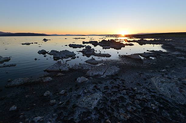 Mono lake at sunrise, the beauty of the sun showing the outline of the Jagged rocks on this volcanic landscape