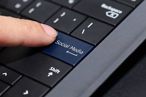 istock finger pushing on  the social media button on laptop  keyboard 491378474