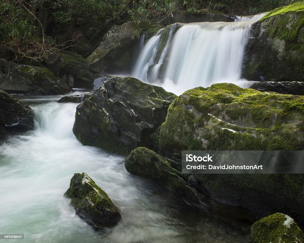 Smoky Mountains Waterfall A waterfall flows through the Middle Prong River in the Great Smoky Mountains National Park. Boulder - Rock Stock Photo