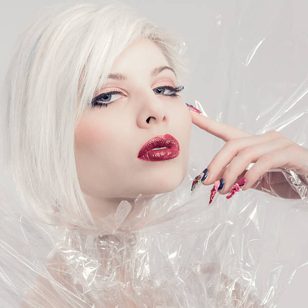 istock Posing blonde fashion model in plastic 491379189