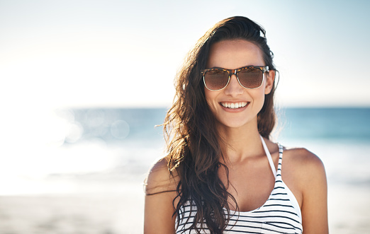 Shot of a young woman enjoying a day at the beachhttp://195.154.178.81/DATA/i_collage/pu/shoots/805663.jpg