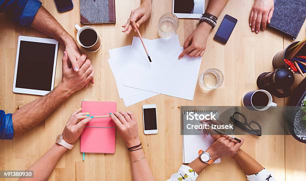 Team Brainstorming High Angle View On The Table Stock Photo - Download Image Now - Conference Table, Table, Marketing