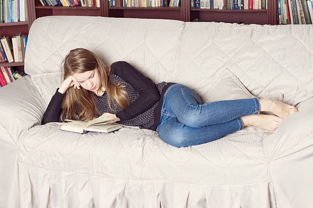 istock Happy Girl  Living Room While Reading 491381460