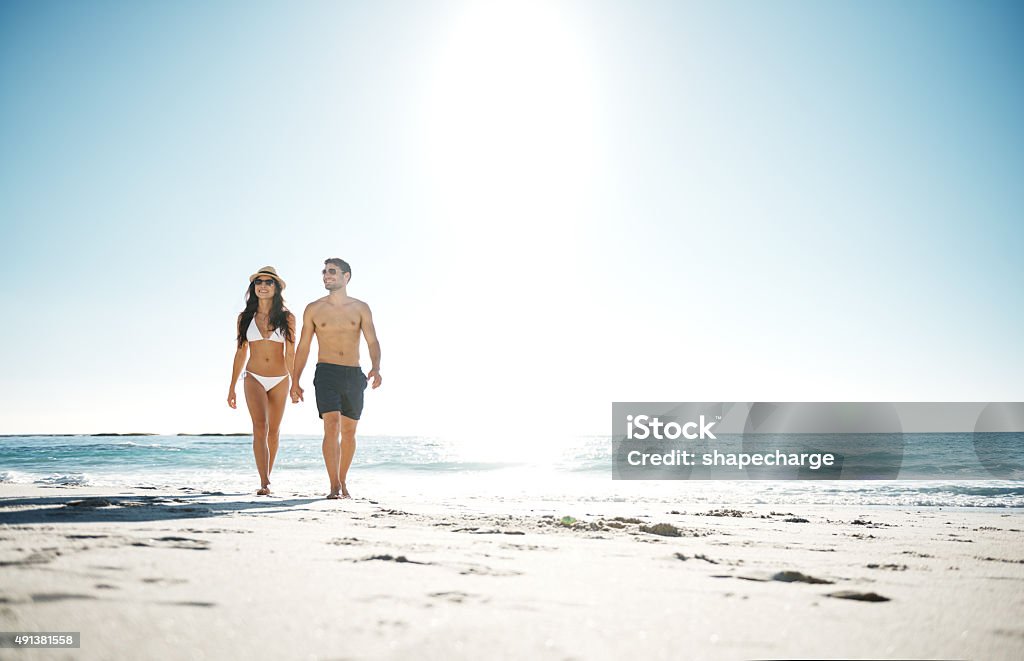 Beautiful day to be at the beach Shot of a young couple going for a walk along the beachhttp://195.154.178.81/DATA/i_collage/pu/shoots/805663.jpg Beach Stock Photo