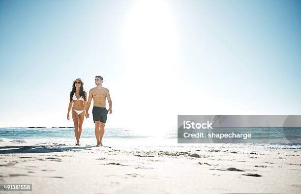 Beautiful Day To Be At The Beach Stock Photo - Download Image Now - Beach, Swimwear, Walking