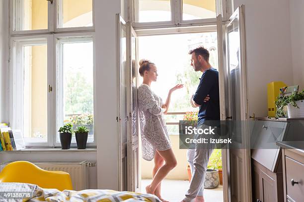 Couple Arguing In The Morning At Home Stock Photo - Download Image Now - Couple - Relationship, Arguing, Discussion