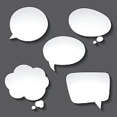 istock Abstract white paper speech bubbles on gray background 491389966