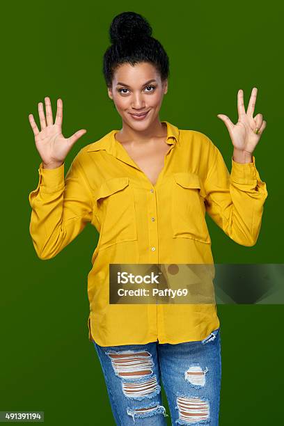 Woman Showing Eight Fingers Stock Photo - Download Image Now - 2015, Adult, Advertisement