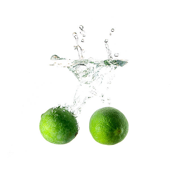 istock Limes splash on water isolated 491391240