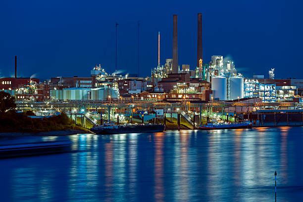 Chemical Park Leverkusen Leverkusen, Germany - October 1, 2015 - Chemical park and sign of German multinational chermical and pharmaceutical company in Leverkusen at night bayer schering pharma ag photos stock pictures, royalty-free photos & images