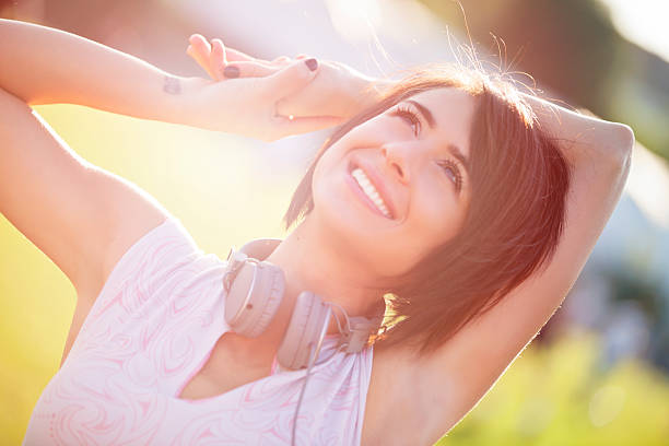 istock Happy young woman outside 491405494
