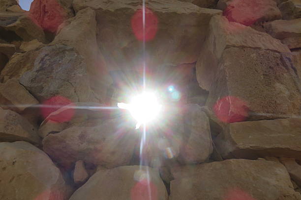 istock Blinding sun through the wall of stones 491405960