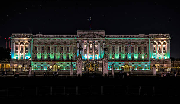 Buckingham Palace in London at night stock photo
