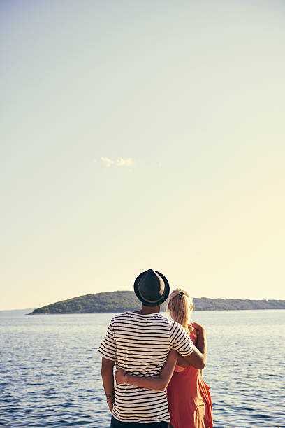 Shot of a young couple looking out onto the oceanhttp://195.154.178.81/DATA/i_collage/pu/shoots/805670.jpg