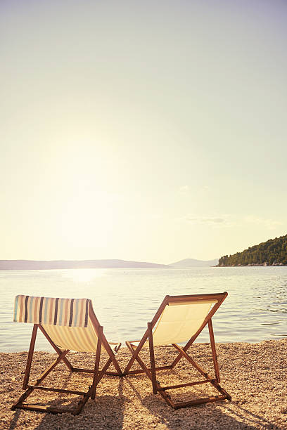 Shot of two outdoor chairs on the beachhttp://195.154.178.81/DATA/i_collage/pu/shoots/805670.jpg