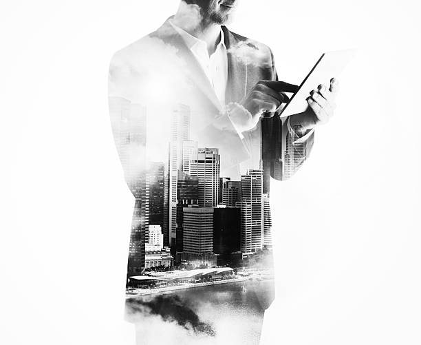 istock Double exposure of city and businessman using digital tablet 491407246