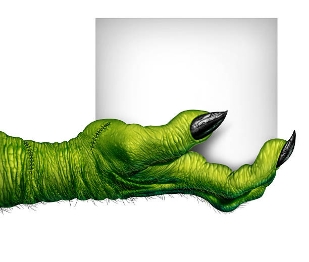Monster Hand Holding Sign Monster hand holding a sign as zombie fingers with blank card as a creepy halloween or scary symbol with textured green skin wrinkled scary fingers and stitches isolated on a white background zombie paper stock pictures, royalty-free photos & images