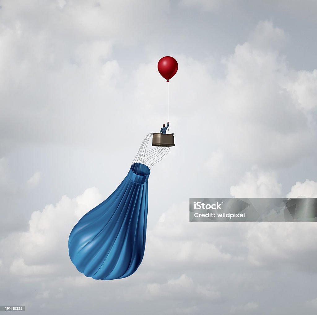 Emergency Business Plan Emergency business plan and crisis management strategy metaphor as a businessman in a broken deflated hot air balloon being saved by a single small red party balloon as an innovative response solution idea. Plan B Stock Photo