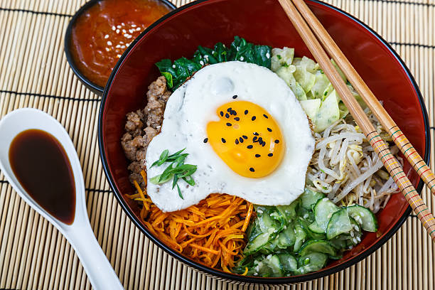 istock Korean cuisine, beef  Bibimbap in red bowl 491411032