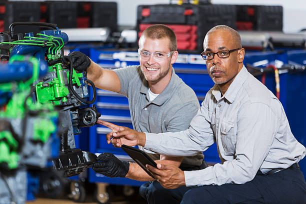 istock Vocational class, learning to repair diesel engine 491411826