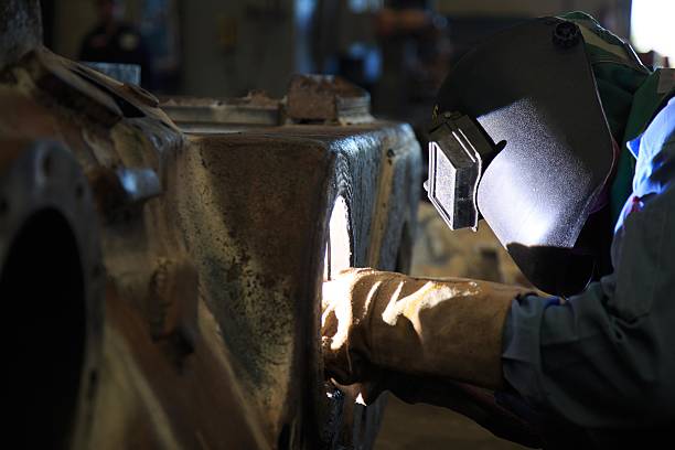 istock Welder is repair frame by shield metal arc welding 491431280