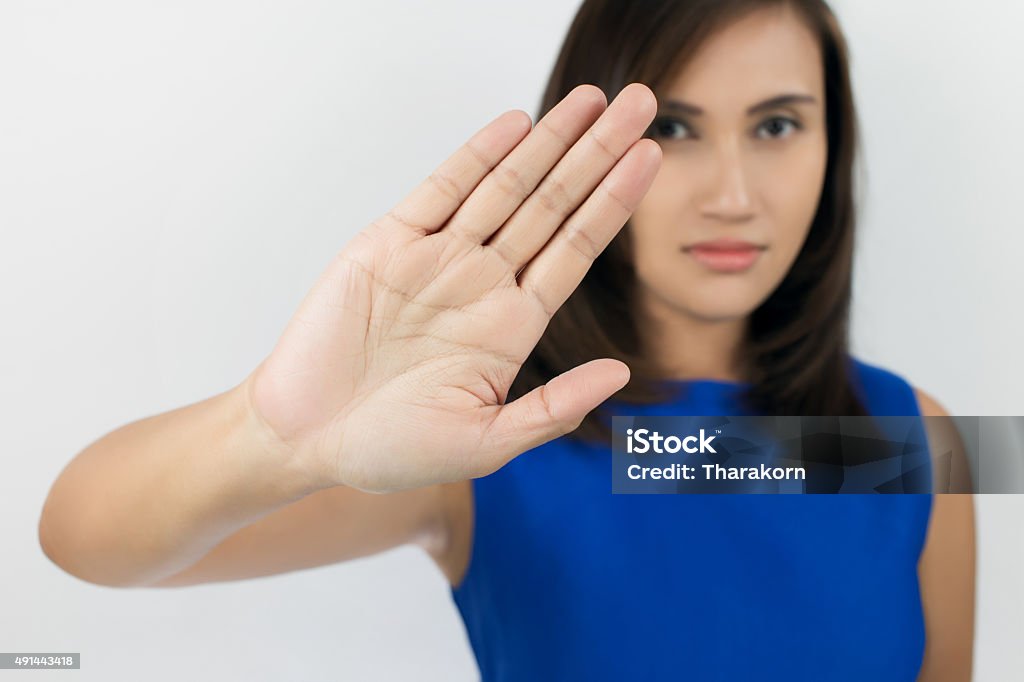 NO on her hand Woman showing her denial with NO on her hand Single Word No Stock Photo