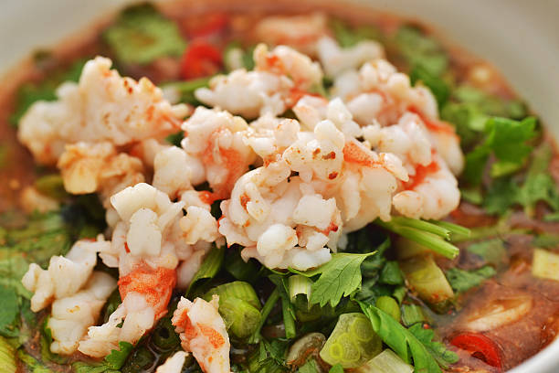 A delicious deep-fried rock lobster dish garnished with golden crispy garlic, offering a perfect combination of crunchy texture and rich, savory flavors.