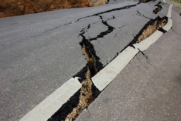 istock broken road by an earthquake in Chiang Rai, thailand 491445359