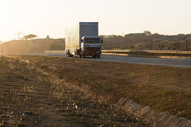 a truck travels along a road